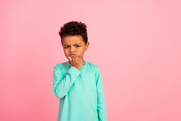 Photo portrait of charming small boy touch chin skeptical moody face dressed stylish cyan clothes...