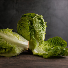 Roman lettuce against a rustic backdrop.