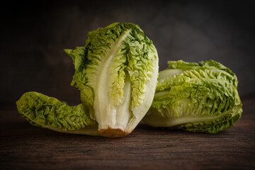 Roman lettuce against a rustic backdrop.