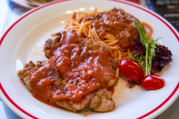 Delicious tomato pork chop with pasta in Hong Kong tea restaurant