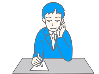 携帯電話で話しながらメモをしている男性