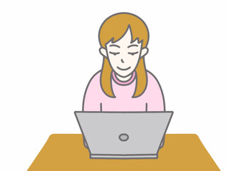 ピンクの服を着てパソコンをしている女性