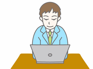 水色のスーツを着てパソコンをしている男性