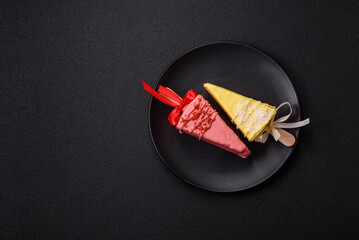 Delicious sweet cheesecake with fruits covered with icing with a wooden stick