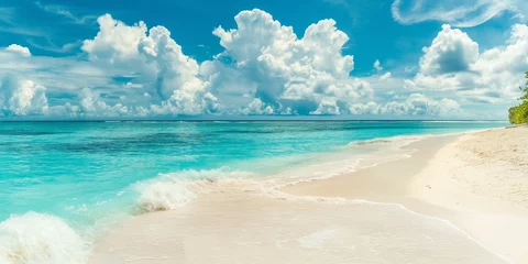 Fototapeten Gorgeous white sand beach with calm, rolling waves of the turquoise ocean on a sunny day with white clouds in the blue sky in the background. © Muhammad