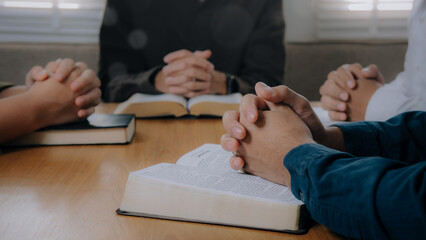 Group of christian people reading the Holy Bible to pray and worship God together in the sunday morning.spirituality, religion,believe.Christian life.Studying the word of God in church. - obrazy, fototapety, plakaty
