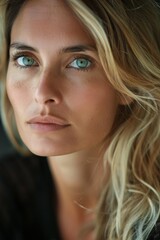 Portrait of a beautiful Italian woman in her 30s, with detailed features that include blonde hair and captivating green eyes. 
