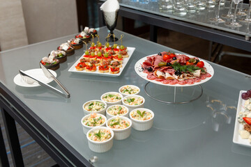 Buffet table with cold appetizers and salads.