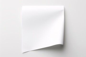 a white paper with curled corner