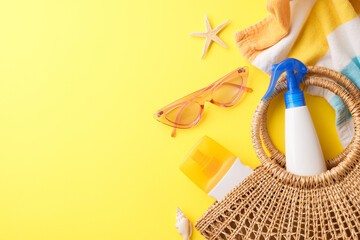 Sunny day essentials: top view of vibrant display of summer beach items including sunglasses,...