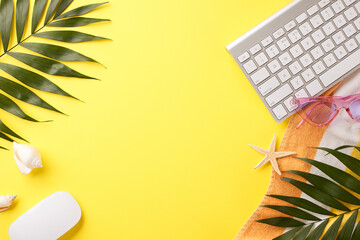 Sunny remote office essentials: lively top view of a keyboard, sunglasses, tropical palm leaves and...