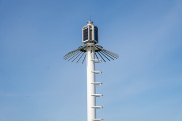 Fototapeta na wymiar Breakwater light beacon with blue sky background