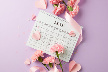 Countdown to Mother's Day: artistic flat lay with calendar and spring flowers, and paper hearts on...