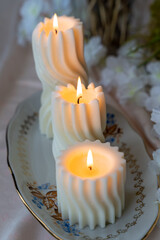 Lit spiral swirl pattern white soy wax candles