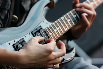 guitarists hands on fretboard - obrazy, fototapety, plakaty
