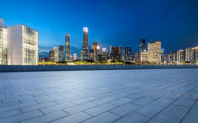 Empty square floors and city skyline with modern buildings scenery at night in Guangzhou