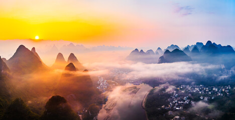Aerial view of the beautiful karst mountains and cloud natural landscape at sunrise in Guilin, China. panoramic view. - obrazy, fototapety, plakaty