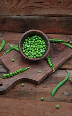 Green beans in a wooden dish.
