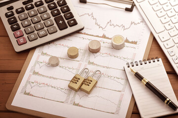 On the stock market chart are various office supplies used for research and investment.The meaning of the Chinese characters in the picture is: the name of the Chinese stock market index