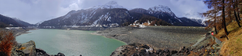 A large reservoir lake - Lai da Marmorera in the European Alps. Switzerland, Springtime.