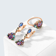 Elegant jewelry set. Jewellery set with gemstones. Product still life concept. Ring, necklace and...