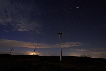 Fototapeta premium Night sky landscape wind turbine