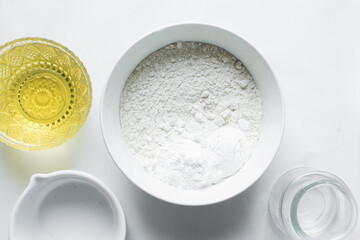 Top view of All purpose flour in a white bowl, baking flour in a bowl