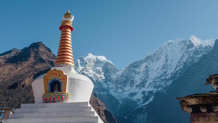 Large white building situated against a backdrop of two large mountains in Nepal, Everest region.