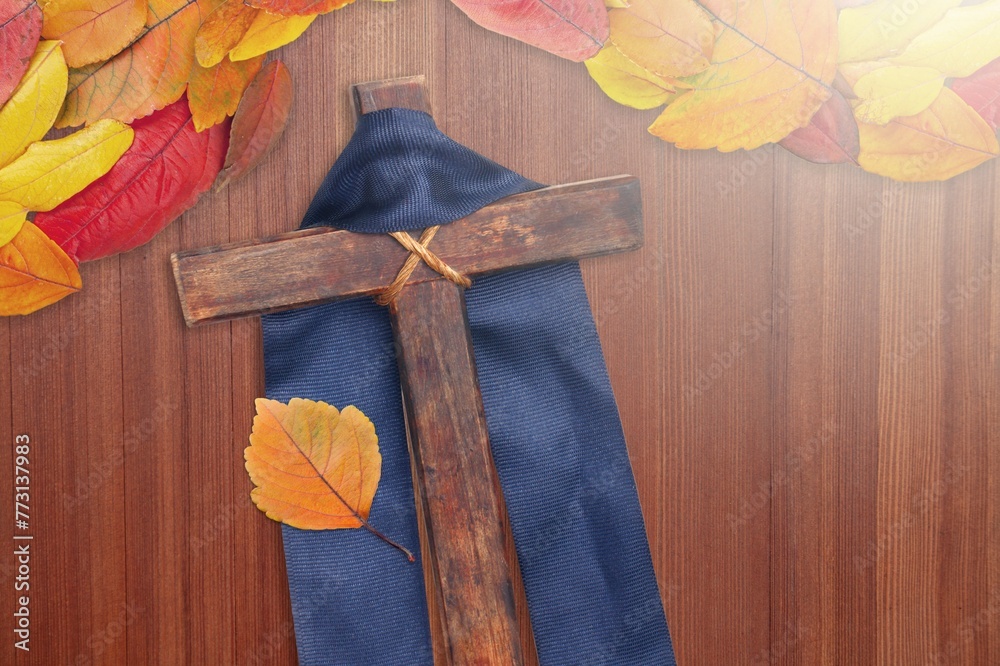 Poster Wooden christian Cross with autumn leaf