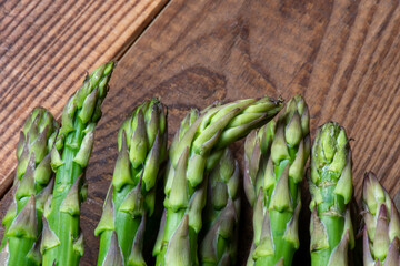 Fresh asparagus on wooden background