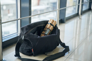 Close up view of time bomb in bag in the public place