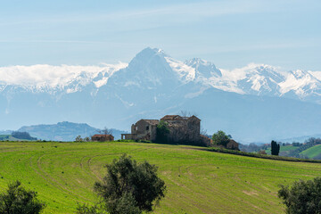 Panoramic view in Mosciano Sant'Angelo, with the snowy Gran Sasso in the background. Province of Teramo, Abruzzo, Italy. - 773147324