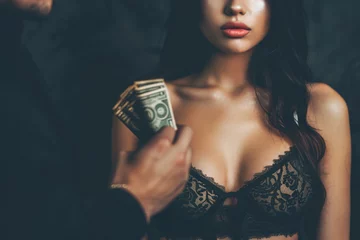 Fotobehang escort and prostitution concept - sexy woman in lingerie taking money from male client © Di Studio