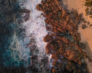 Aerial view of a tropical island with rugged rock formations surrounded by turquoise sea