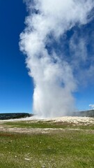 Fototapeta na wymiar Majestic geyser spewing steam and hot water into the air in the US