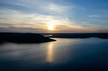 Beautiful landscape of tranquil blue lake at vibrant beautiful dusk