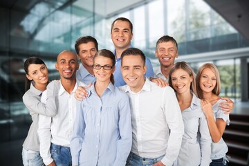 Group team of happy successful employees in workspace