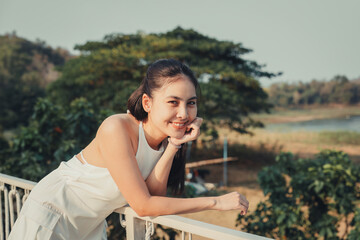 Beautiful asian woman enjoying and smiling at the camera on vacation - 773154130