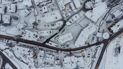 Aerial shot of the snow-covered streets and building in Ski Resort Bukovel, Ukraine