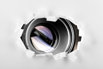 Camera lens for taking pictures in torn hole in paper