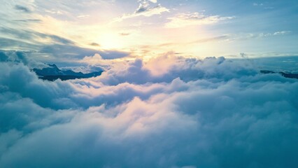 Aerial shot of clouds over the mountains in Yunnan province, China. - obrazy, fototapety, plakaty