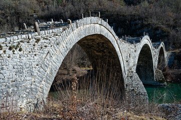 View of the traditional stone Kalogeriko or Plakida  Bridge in Zagori of Epirus, Greece in winter.