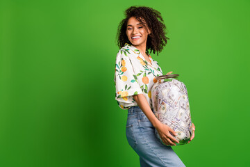 Photo of positive good mood woman dressed print shirt collecting heavy money glass jar empty space...