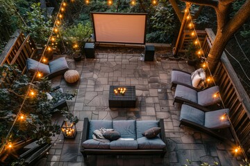 A patio is abundantly filled with various furniture pieces, including tables, chairs, and sofas, illuminated by numerous string lights