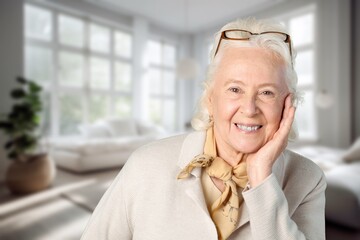 Happy positive elder woman at home