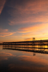 Fototapeta na wymiar Captivating sunset scenery unfolds at The Rio Tinto Pier (Muelle de Rio Tinto) in Huelva, Andalusia, Spain