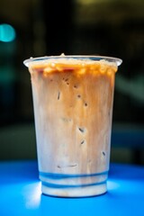 cold coffee in the evening in a coffee shop on a blue table