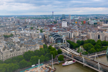 Charing Cross Station, Hungerford Bridge and Golden Jubilee Bridge aerial view over River Thames in...