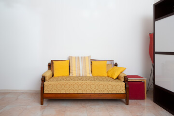 vintage-inspired sofa with yellow cushions in a cozy corner