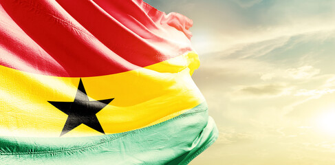 Ghana national flag waving in the sky.